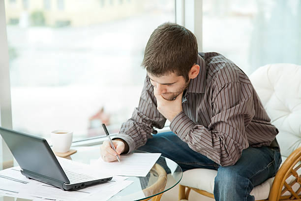 man filling out forms