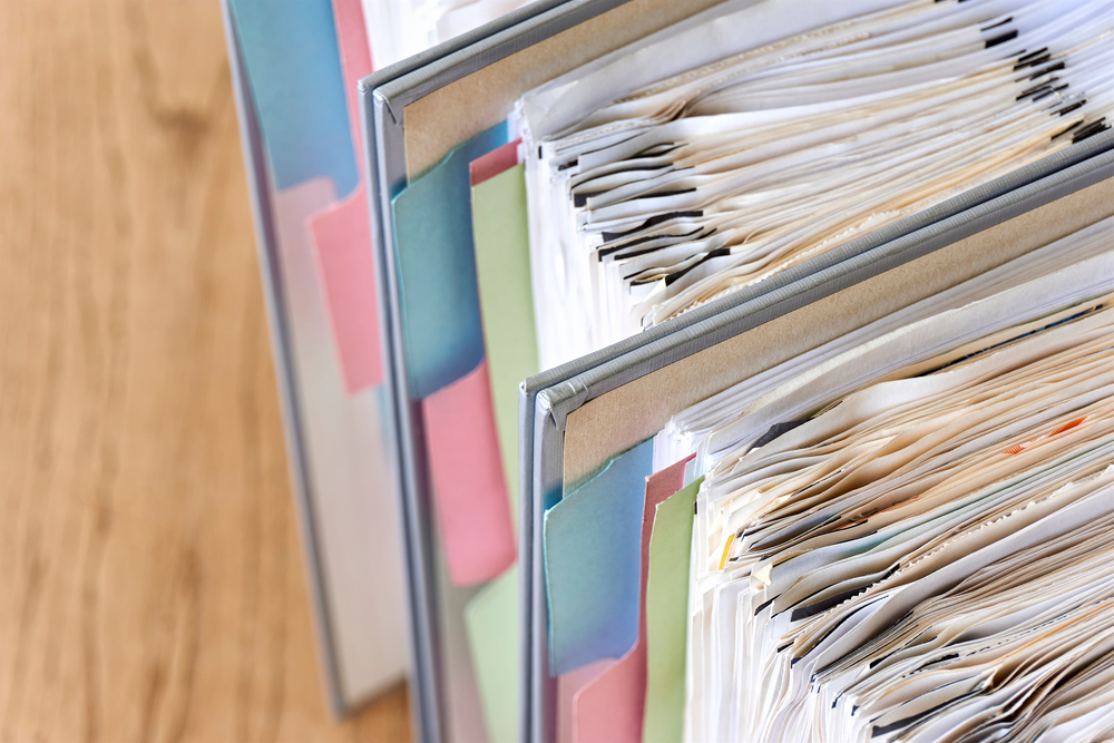 Stacks of paper in filing folders